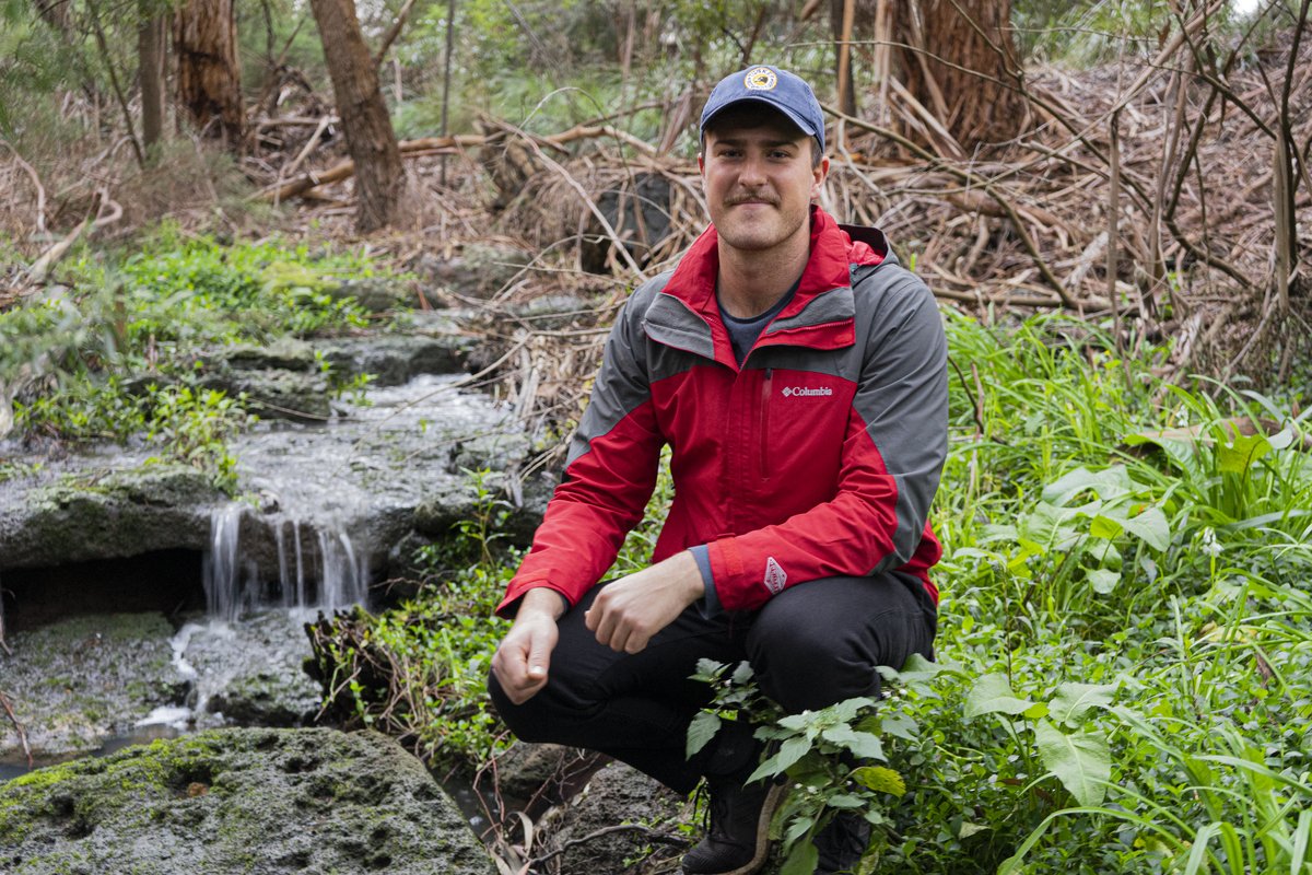 Jack Manera in the field conducting research at a freshwater stream